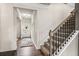 Elegant stairwell with iron railing and carpet at 277 Silver Leaf Trl, Douglasville, GA 30134