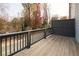 Deck with a view of a wooded area and residential street at 3829 Oxford Cir, Doraville, GA 30340