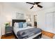 Well-lit bedroom, featuring hardwood floors and built-in shelving at 490 E Pharr Rd, Decatur, GA 30030