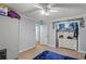 Bedroom with blue bedspread, ceiling fan, and white dresser at 5861 Community Rd, Mableton, GA 30126