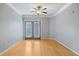 Living room with hardwood floors and sliding glass doors at 10 Perimeter Summit Ne Blvd # 3207, Atlanta, GA 30319