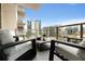 Relax on this furnished balcony with city views at 40 12Th Ne St # 1406, Atlanta, GA 30309