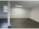 Spacious finished basement with laminate flooring at 7805 Poppy Dr, Winston, GA 30187