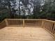 Wooden deck overlooking a wooded backyard at 7805 Poppy Dr, Winston, GA 30187