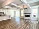 Spacious living room with coffered ceiling, fireplace, and hardwood floors at 1883 Westfall Landing, Auburn, GA 30011