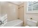 Simple bathroom with a tub and toilet at 220 Spring Branch Dr, Canton, GA 30115