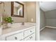 Clean bathroom with vanity, mirror, and plant at 220 Spring Branch Dr, Canton, GA 30115