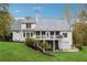 White two-story house with large deck and screened porch at 220 Spring Branch Dr, Canton, GA 30115
