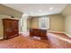 Bright office with wood desk, built-in cabinet, and carpet at 220 Spring Branch Dr, Canton, GA 30115
