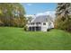 White two-story house with a large backyard at 220 Spring Branch Dr, Canton, GA 30115