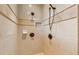 Large tiled shower with dual shower heads and built-in shelving at 220 Spring Branch Dr, Canton, GA 30115