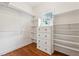 Large walk-in closet with built-in shelves and drawers at 220 Spring Branch Dr, Canton, GA 30115