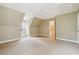 Bright bedroom featuring a ceiling fan and access to a hallway at 220 Spring Branch Dr, Canton, GA 30115