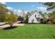 White house with driveway and manicured lawn at 220 Spring Branch Dr, Canton, GA 30115