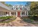 White house with red front door and a long driveway at 220 Spring Branch Dr, Canton, GA 30115