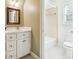 Bathroom with a tub, toilet and vanity at 220 Spring Branch Dr, Canton, GA 30115