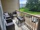 Private balcony with seating area overlooking the community and surrounding greenery at 4805 West Village Way # 3207, Smyrna, GA 30080