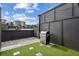 Enjoy grilling and city views on this private rooftop deck with artificial turf at 1225 Chelsea Nw Cir, Atlanta, GA 30318