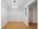 Bright dining room with hardwood floors and a modern light fixture at 3705 Essex Ave, Atlanta, GA 30339