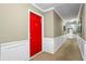 Inviting entry hall with red door and elegant wainscoting at 3705 Essex Ave, Atlanta, GA 30339