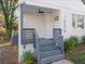 Inviting front porch with gray railings and steps at 1436 Lanvale Sw Dr, Atlanta, GA 30310