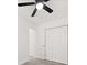 Bedroom with ceiling fan, double-door closet, and wood-look floors at 1436 Lanvale Sw Dr, Atlanta, GA 30310