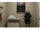 Laundry room with a hamper, shelving, and a plant at 2908 Alliteration Ave, Buford, GA 30519