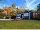 House exterior showcasing a spacious yard and autumn foliage at 3337 Camens Way, Buford, GA 30519