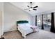 Main bedroom with ceiling fan, large windows, and plush carpet at 3337 Camens Way, Buford, GA 30519