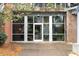 Modern glass entryway to the Dynamic Metals Lofts building at 572 Edgewood Ne Ave # 306, Atlanta, GA 30312