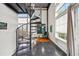 Modern spiral staircase leads to the upper loft level at 572 Edgewood Ne Ave # 306, Atlanta, GA 30312