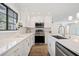 Modern kitchen with stainless steel appliances and white cabinetry at 513 Duke Dr, Marietta, GA 30066