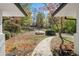 Inviting front yard with mature trees and a winding walkway at 513 Duke Dr, Marietta, GA 30066