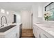 White kitchen with stainless steel appliances and quartz countertops at 513 Duke Dr, Marietta, GA 30066