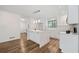 Modern kitchen with white cabinets, quartz countertops and large island at 513 Duke Dr, Marietta, GA 30066