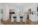Modern kitchen with white shaker cabinets and island at 513 Duke Dr, Marietta, GA 30066