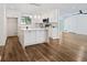 Open concept kitchen with island, white cabinets and stainless steel appliances at 513 Duke Dr, Marietta, GA 30066