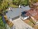 Aerial view of a home with a large driveway and mature trees at 513 Duke Dr, Marietta, GA 30066