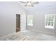 Spacious main bedroom with two windows and an ensuite bathroom at 493 Benson Meadows Dr, Dallas, GA 30157