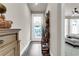 Long hallway with wood-look flooring and access to bedrooms at 124 Pearl St, Woodstock, GA 30188