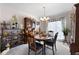 Bright dining room with a table, chairs, and a built-in hutch at 2000 Spicers Ln, Woodstock, GA 30189