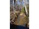 Small creek running through a wooded area at 1765 Holly Springs Ne Rd, Marietta, GA 30062
