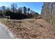 Open land with a fence and power lines visible in the background at 1765 Holly Springs Ne Rd, Marietta, GA 30062
