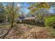 Charming one-story home with white siding, green shutters, and a front porch at 1765 Holly Springs Ne Rd, Marietta, GA 30062
