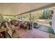 Large covered porch with brick floor and outdoor furniture at 1765 Holly Springs Ne Rd, Marietta, GA 30062
