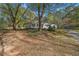 White house exterior with mature trees and a grassy yard at 1765 Holly Springs Ne Rd, Marietta, GA 30062