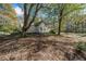 Charming one-story home with white siding, green shutters, and a front porch at 1765 Holly Springs Ne Rd, Marietta, GA 30062