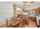 Cozy eat-in kitchen with wood cabinets and a stone feature wall at 1765 Holly Springs Ne Rd, Marietta, GA 30062