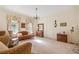 Living room with hardwood floors, large windows, and antique furniture at 1765 Holly Springs Ne Rd, Marietta, GA 30062