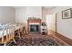 Classic dining room with hardwood floors, fireplace, and a table set for a meal at 1765 Holly Springs Ne Rd, Marietta, GA 30062